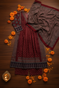 Maroon Kurta Flat Lay – Dark Wood & Marigolds
